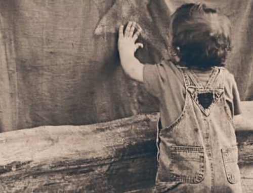 A boy leaning on the Wall